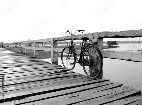 Obraz w ramie Bicycle on wooden bridge