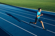 © Jacob Lund - Young male athlete training on a race track