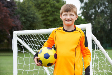 Sticker - Portrait Of Goal Keeper Holding Ball On School Soccer Pitch