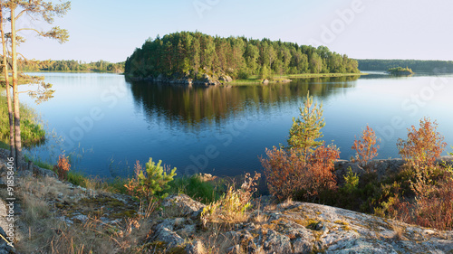 Cuadros en Lienzo Ladoga lake with island under sunlight