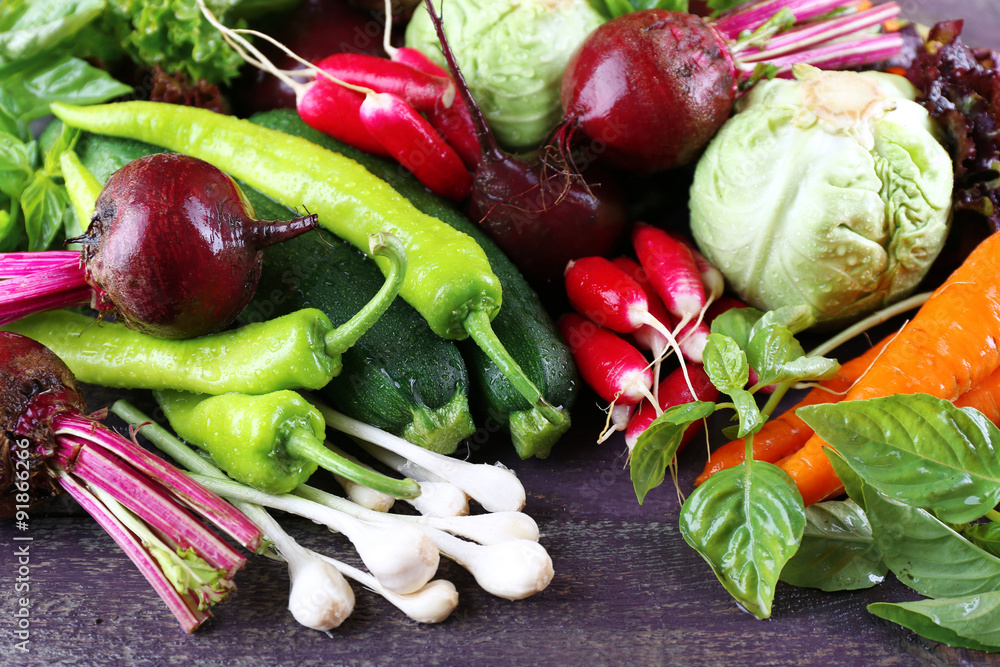 Heap of fresh vegetables on table close up
