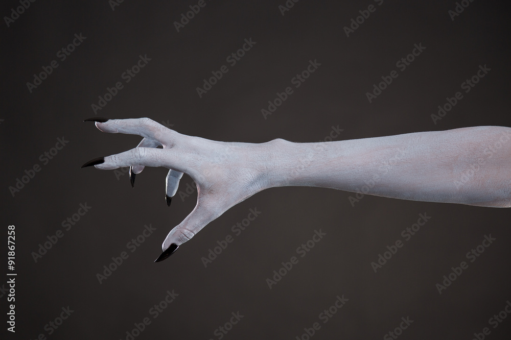 Scary pale skin hand with black nails Stock Photo | Adobe Stock