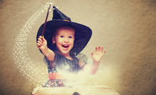 Halloween. Cheerful Little Witch With A Magic Wand And Glowing B