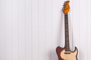 Canvas Print - Electric guitar on white wooden wall background