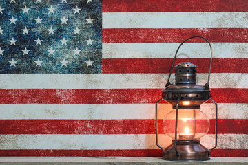 Antique lantern by vintage American flag canvas background