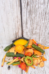 Mix vegetable chips over wooden background