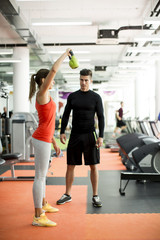 Wall Mural - Young man training in the gym