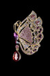 a golden butterfly gem encrusted brooch