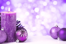 Purple Christmas Scene With Baubles And Candles