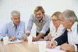 © goodluz - Business instructor with group of senior people