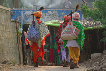 Two men in traditional Indian clothing. Recluse 