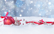 Christmas background with red baubles,snow and snowflakes, free space for text. Christmas decoration. 