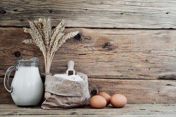 Poster - bag of flour with spikelets of wheat, milk and eggs