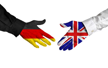 Wall Mural - Germany and United Kingdom leaders shaking hands on a deal agreement