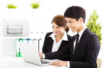 Wall Mural - happy business man and woman working  in office