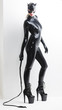 © Richard Semik - standing woman wearing latex clothes with a whip