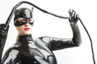 © Richard Semik - portrait of standing woman wearing latex clothes with a whip