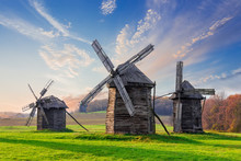 Old Windmills On A Background Of Forest And Sky