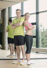 Wall Mural - smiling man and woman in gym