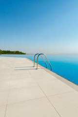 Poster - Infinity pool on the bright summer day