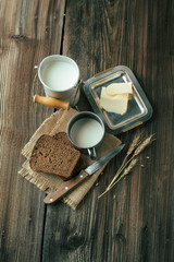 Wall Mural - Black bread and milk on old wooden