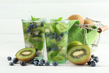 Wall Mural - Kiwi and Blueberry cocktails on color wooden background