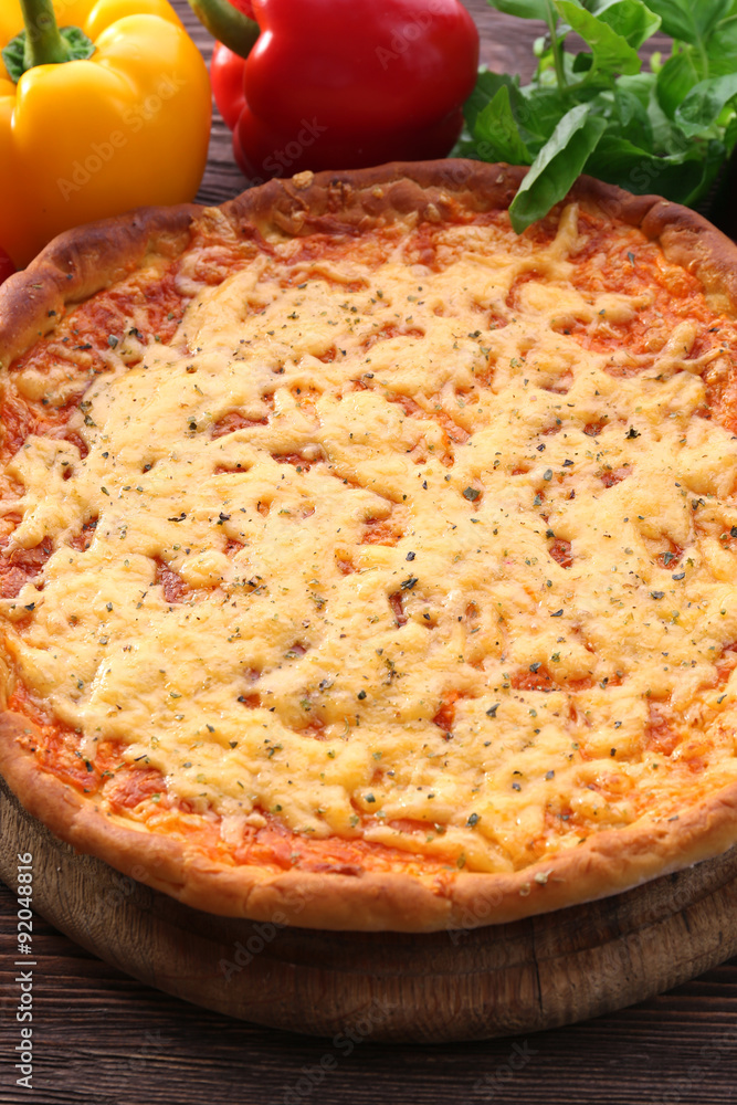 Cheese pizza with vegetables on table close up