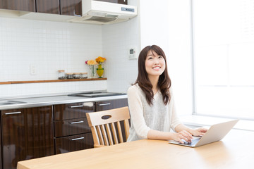 Wall Mural - young asian womman using laptop