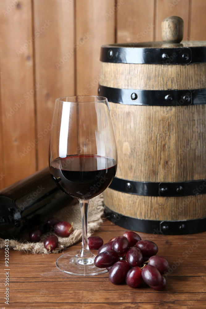 Beautiful still life with wine and grape on wooden table