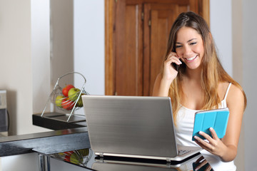 Poster - Woman multi tasking working with a laptop tablet and phone