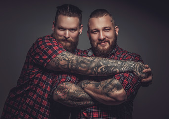 Wall Mural - Two smiling friends with beards and tattooes