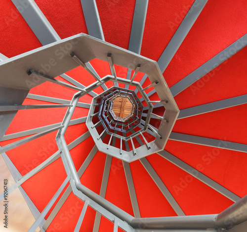 Naklejka - mata magnetyczna na lodówkę spiral staircase with red carpet in a building