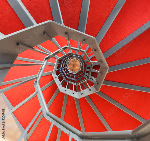 Tapeta ścienna na wymiar spiral staircase with red carpet in a building