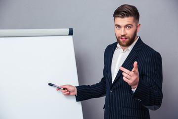 Sticker - Businessman presenting something on blank board