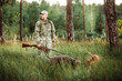 yang Hunter with Rifle and Dog in forest