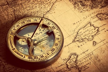 Fototapete - Old compass on vintage map. Retro stale.