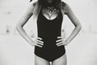 © bedya - Young pretty women on the beach in black swimwear