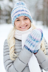 smiling young woman in winter forest