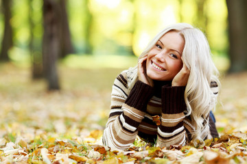 Woman on autumn leaves