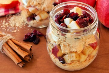 Wall Mural - autumn overnight oats with apples and cranberries in a mason jar