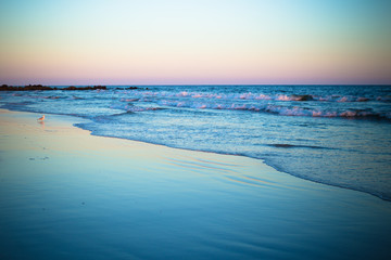 Beautiful ocean shoreline at beach at sunset