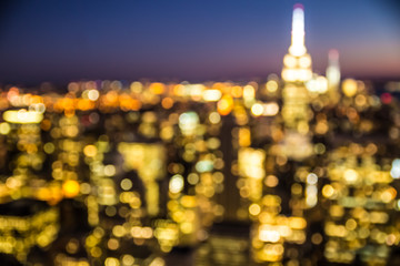 Fototapete - Defocused blur of New York City buildings lights at night