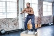 © Wavebreak Media - Fit man doing box jumps