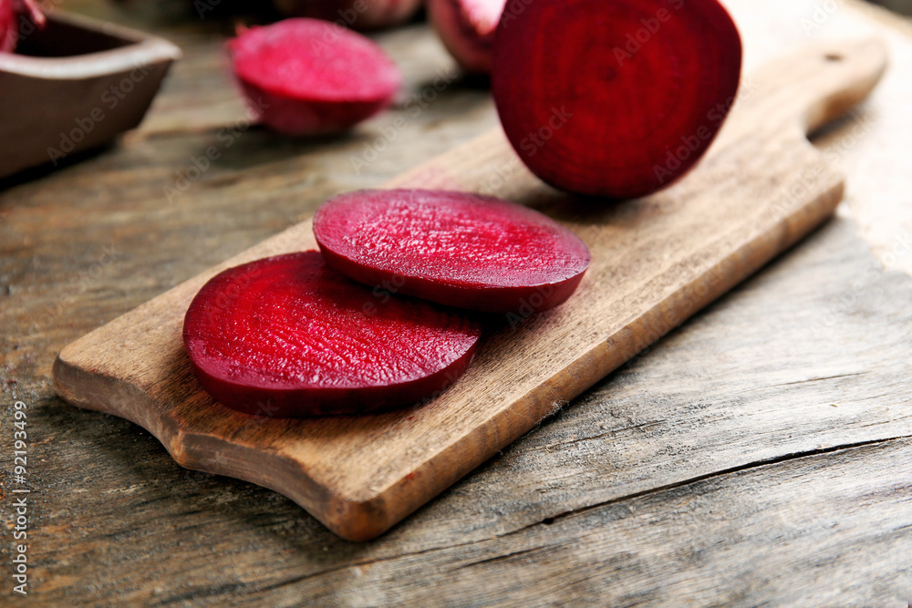 Young beets on wooden table close up