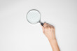 © aradaphotography - A female(woman) hand hold a magnifier(reading glass) isolated wh