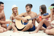 © Africa Studio - Beautiful young people with guitar having fun on beach