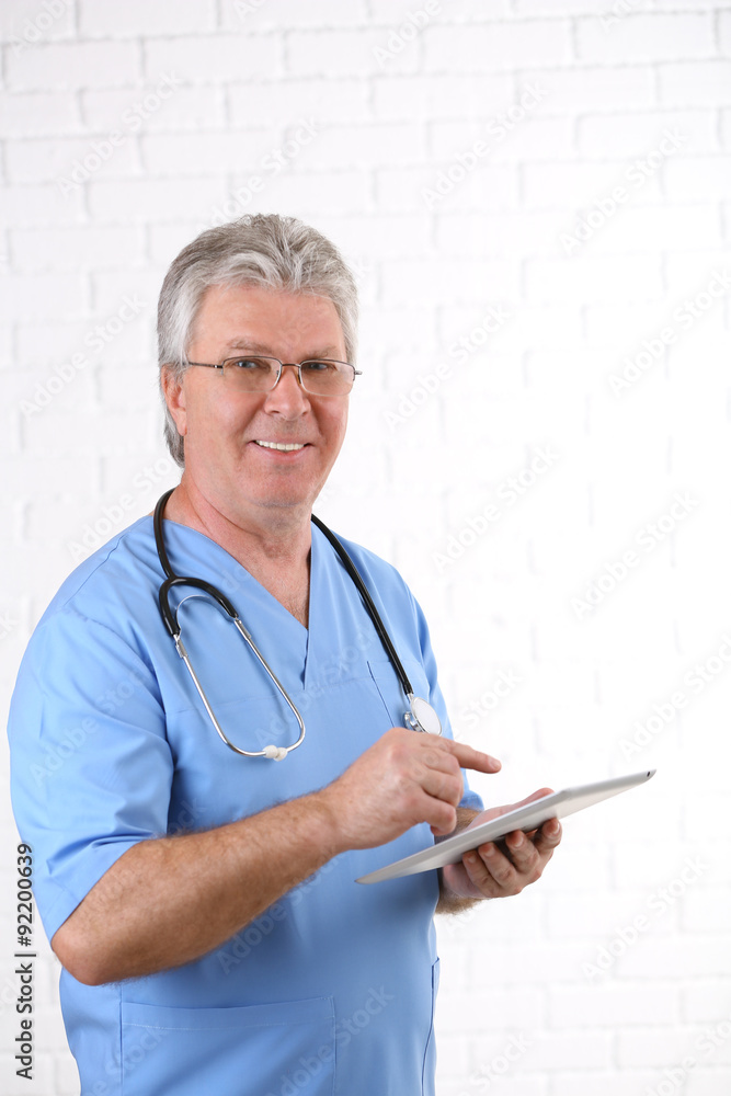 Doctor with digital tablet  on light background