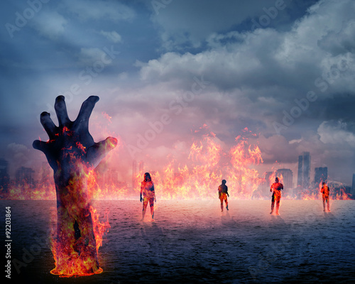 Obraz na płótnie Ręka zombie z ogniem wznoszącym się z ziemi