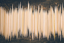 Big Pile Of Toothpicks Lying In An Uneven Horisontal Line On