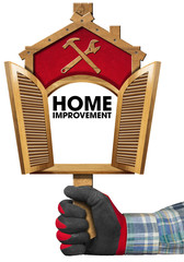 Home Improvement Sign with Open Window / Hand with work glove holding a wooden sign in the shape of house with empty open window. Isolated on white background